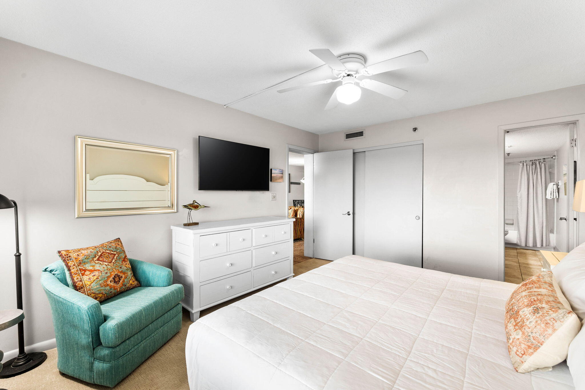 600 Gulf Shore Drive, Unit 304 Destin, FL 32541 - Photo 22 of 38 a bedroom with a large bed and a flat screen tv
