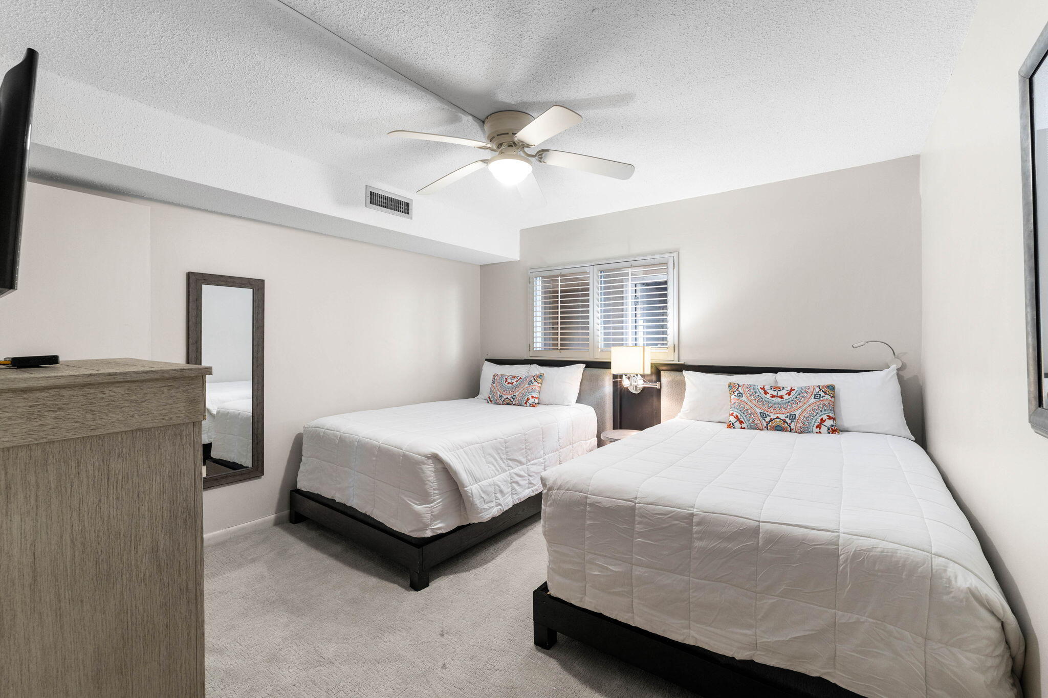 600 Gulf Shore Drive, Unit 304 Destin, FL 32541 - Photo 25 of 38 a bedroom with a bed and a flat screen tv