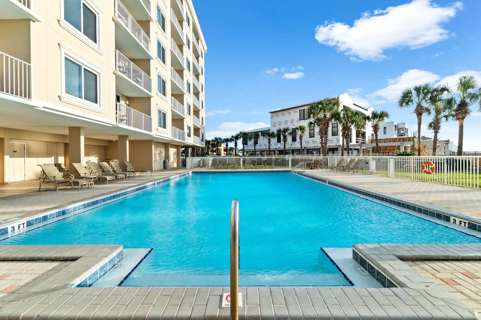 600 Gulf Shore Drive, Unit 304 Destin, FL 32541 - Photo 28 of 38 a view of an swimming pool with a lawn chairs