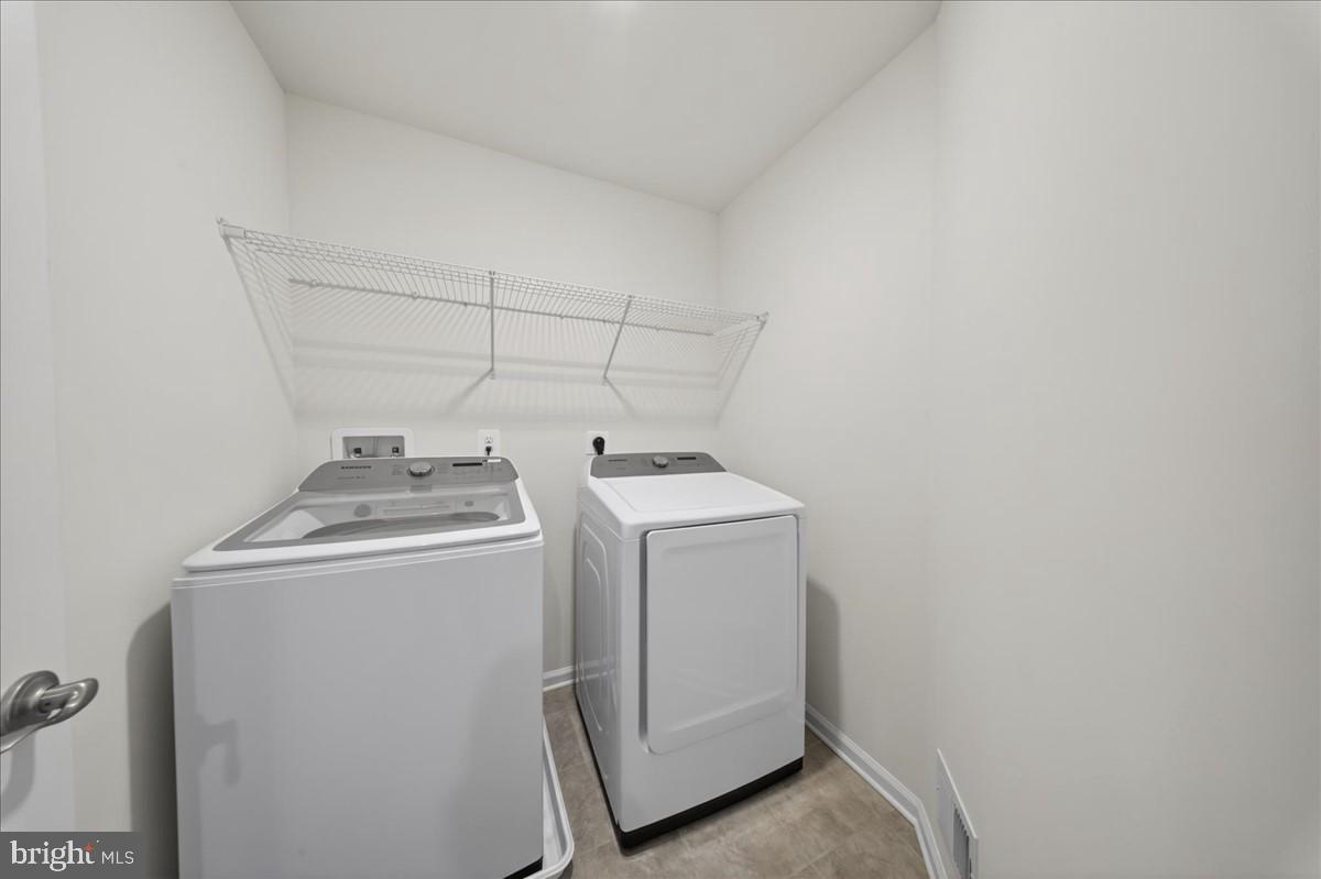 38023 Cross Gate Road Millville, DE 19967 - Photo 24 of 37 a utility room with dryer and washer