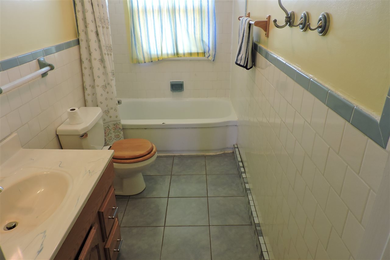 1941 Lyndhurst Road Waynesboro, VA 22980 - Photo 22 of 30 a bathroom with a sink a toilet and shower