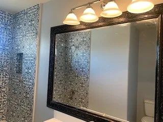 a bathroom with a shower and a sink