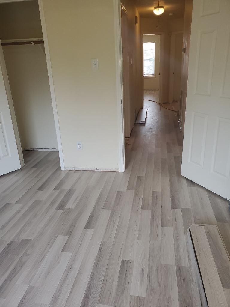 9418 Parsley Path Lane Houston, TX 77064 - Photo 2 of 20 a view of a hallway with wooden floor