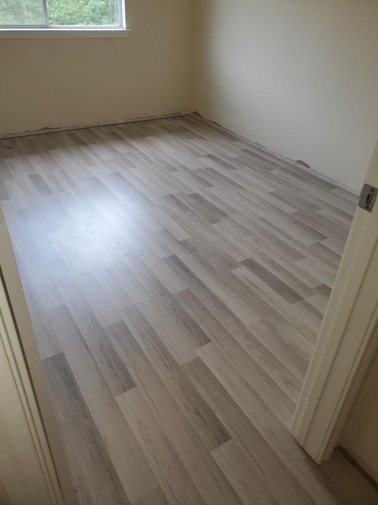 9418 Parsley Path Lane Houston, TX 77064 - Photo 3 of 20 a view of an empty room with wooden floor and window