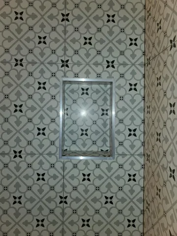 a bathroom with a window and a shower curtain