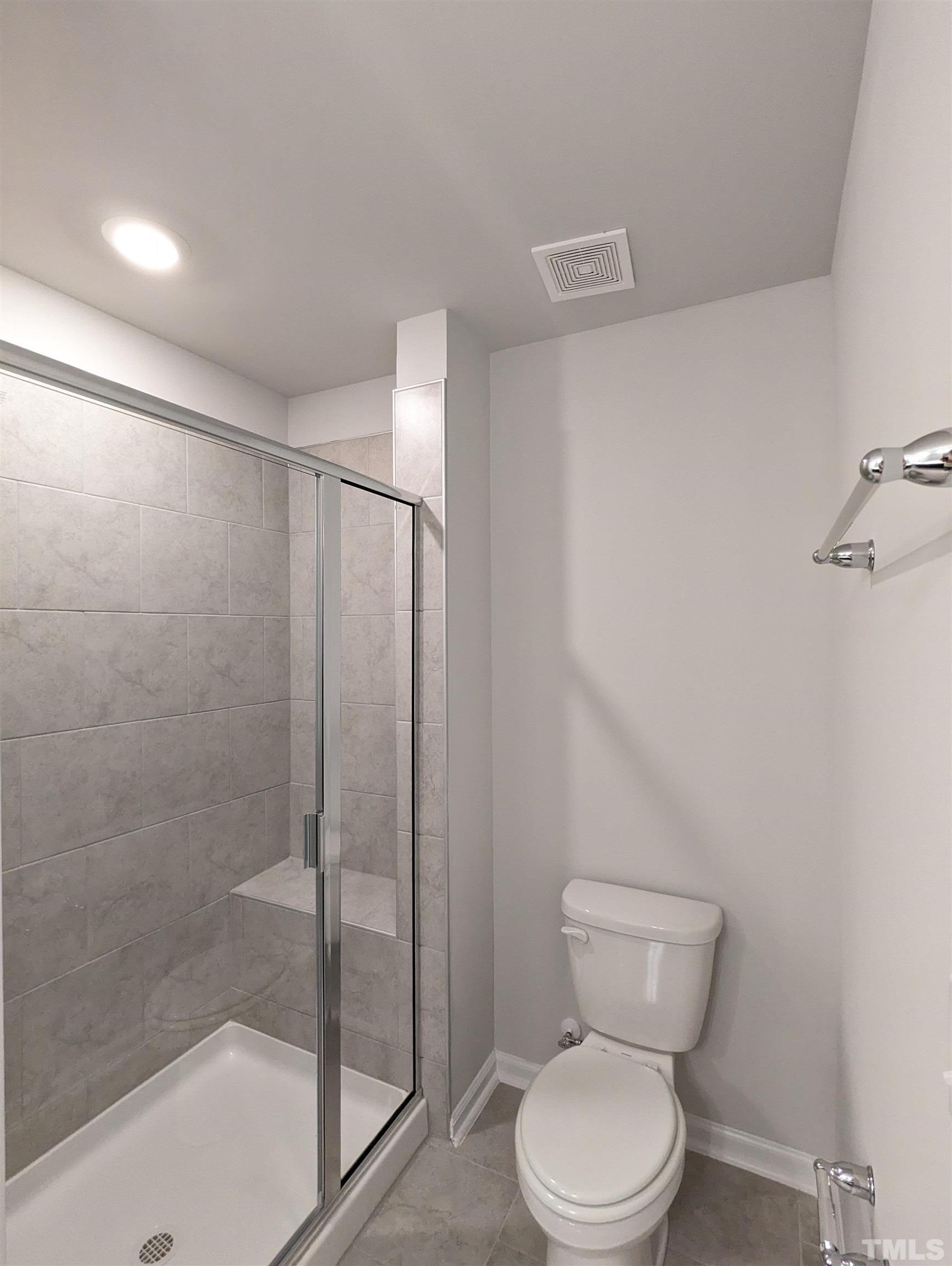 604 Gimari Drive Wake Forest, NC 27587 - Photo 11 of 20 a bathroom with a toilet and a shower