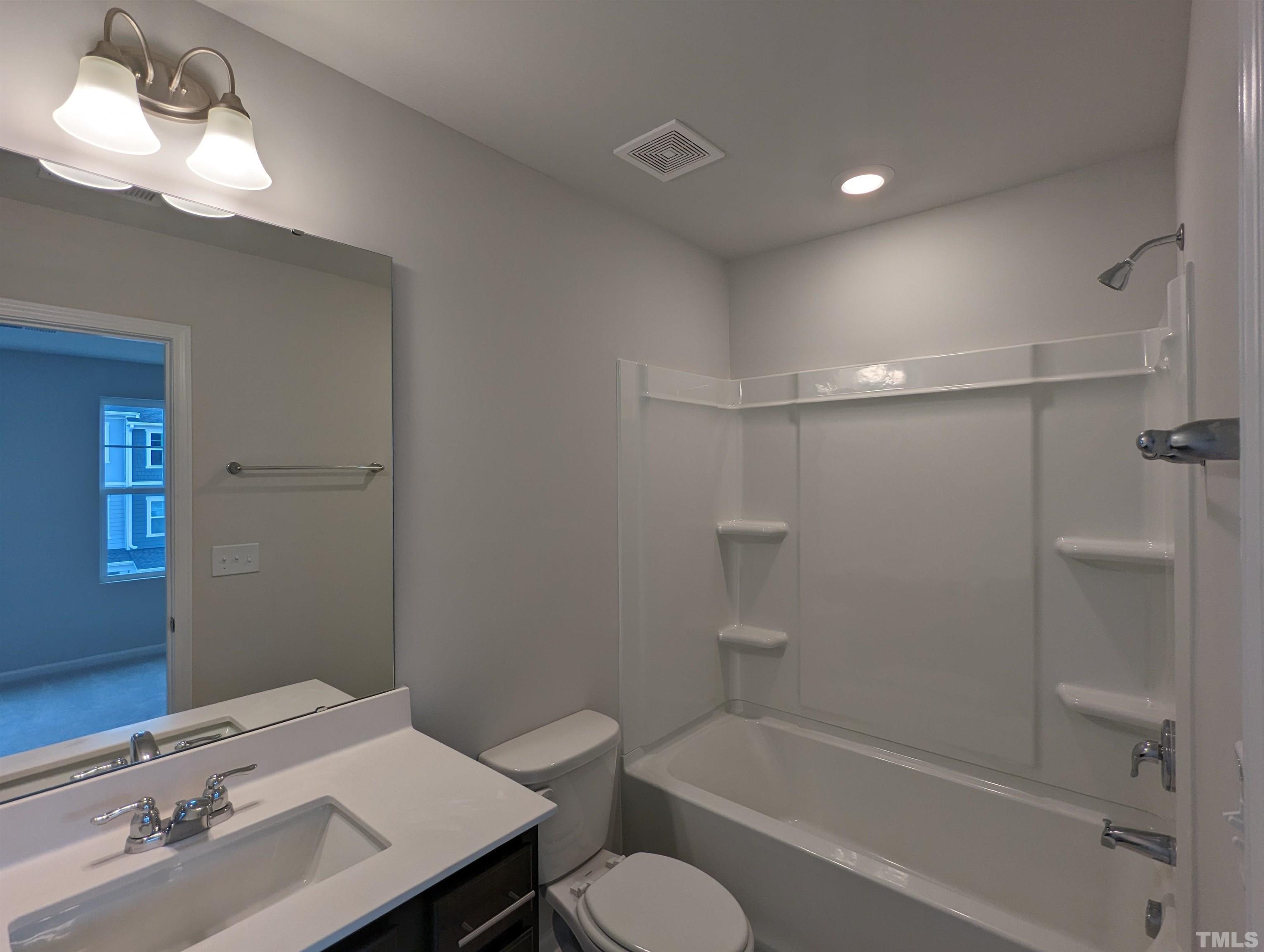 604 Gimari Drive Wake Forest, NC 27587 - Photo 13 of 20 a bathroom with a sink toilet and shower