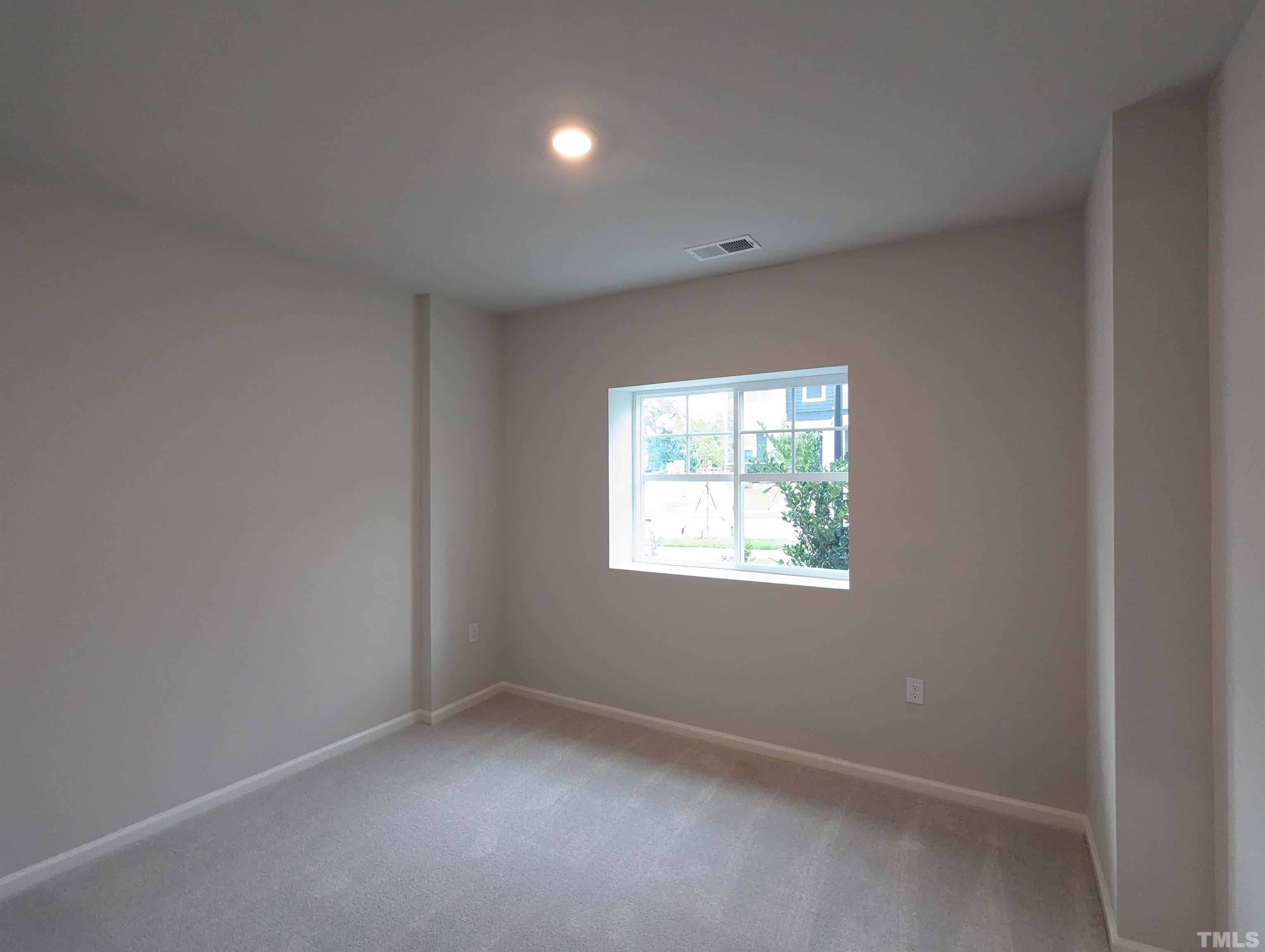 604 Gimari Drive Wake Forest, NC 27587 - Photo 6 of 20 an empty room with windows