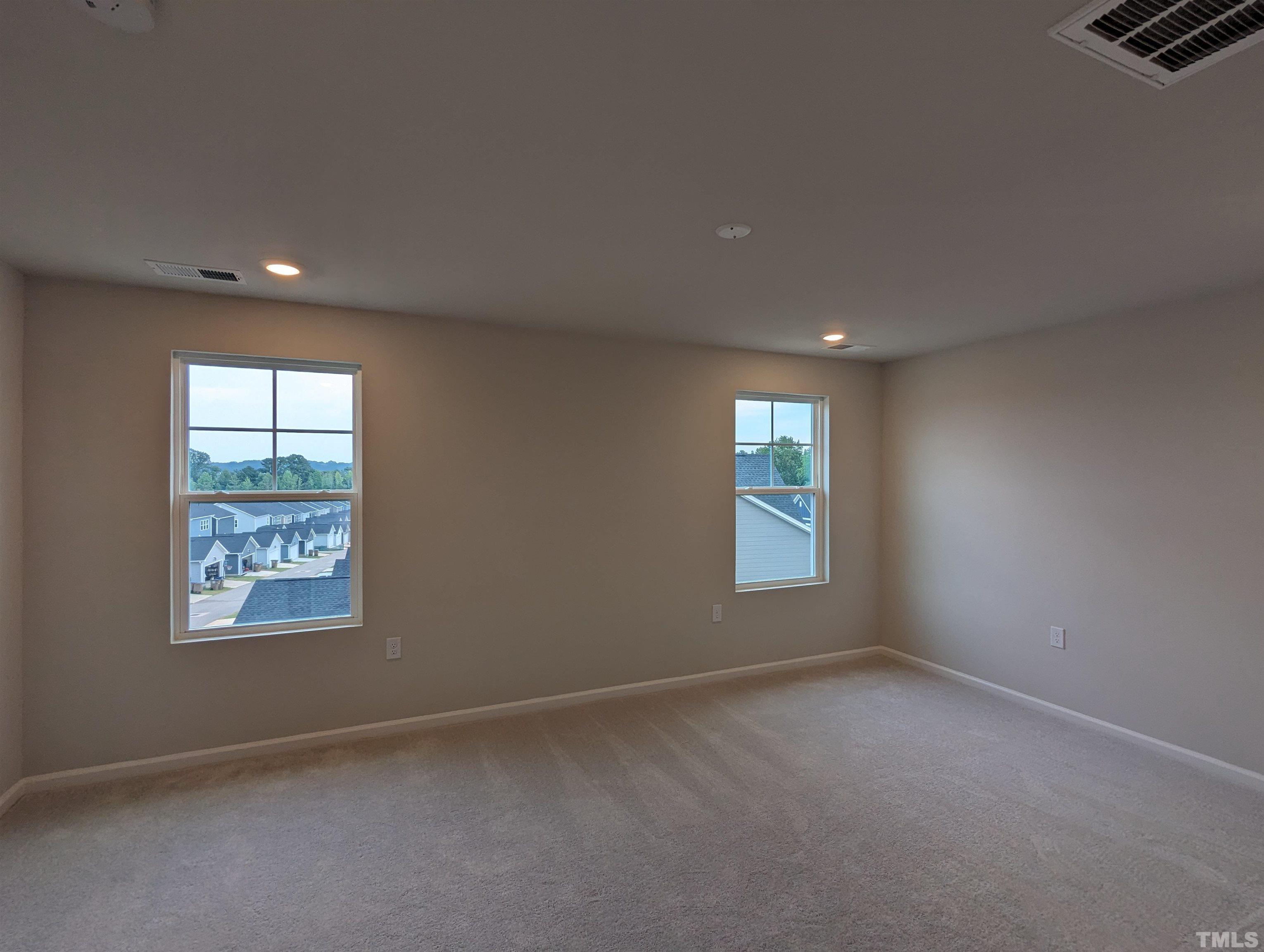604 Gimari Drive Wake Forest, NC 27587 - Photo 8 of 20 an empty room with windows