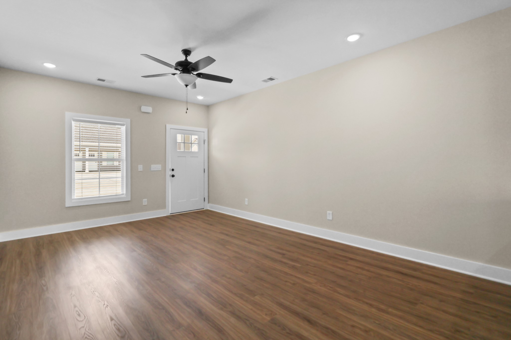 1007 Oak Street, Unit B Portland, TN 37148 - Photo 12 of 29 wooden floor in an empty room with a window