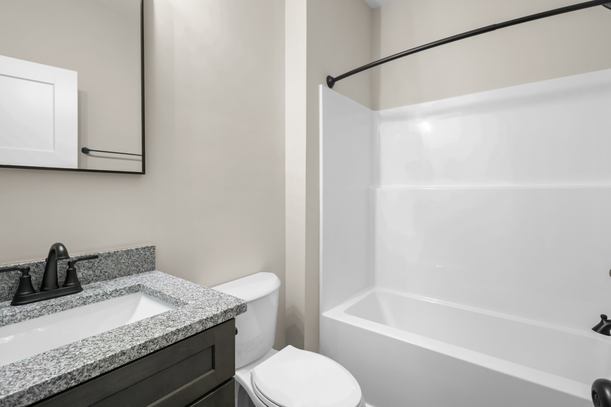 1007 Oak Street, Unit B Portland, TN 37148 - Photo 13 of 29 a bathroom with a granite countertop sink toilet and shower
