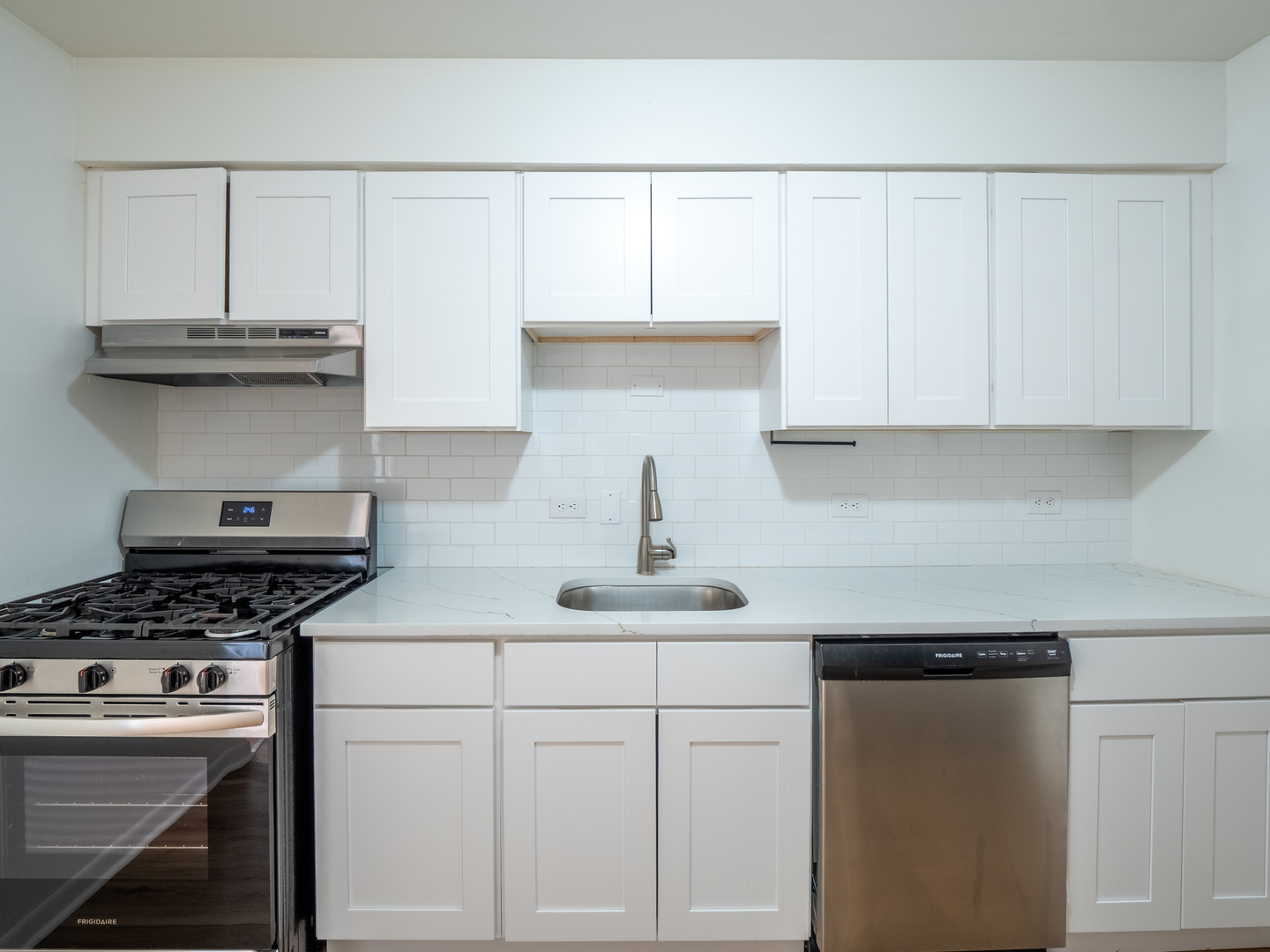 9662 Golf Terrace, Unit 2E Des Plaines, IL 60016 - Photo 3 of 24 a kitchen with stainless steel appliances granite countertop a sink a stove and cabinets