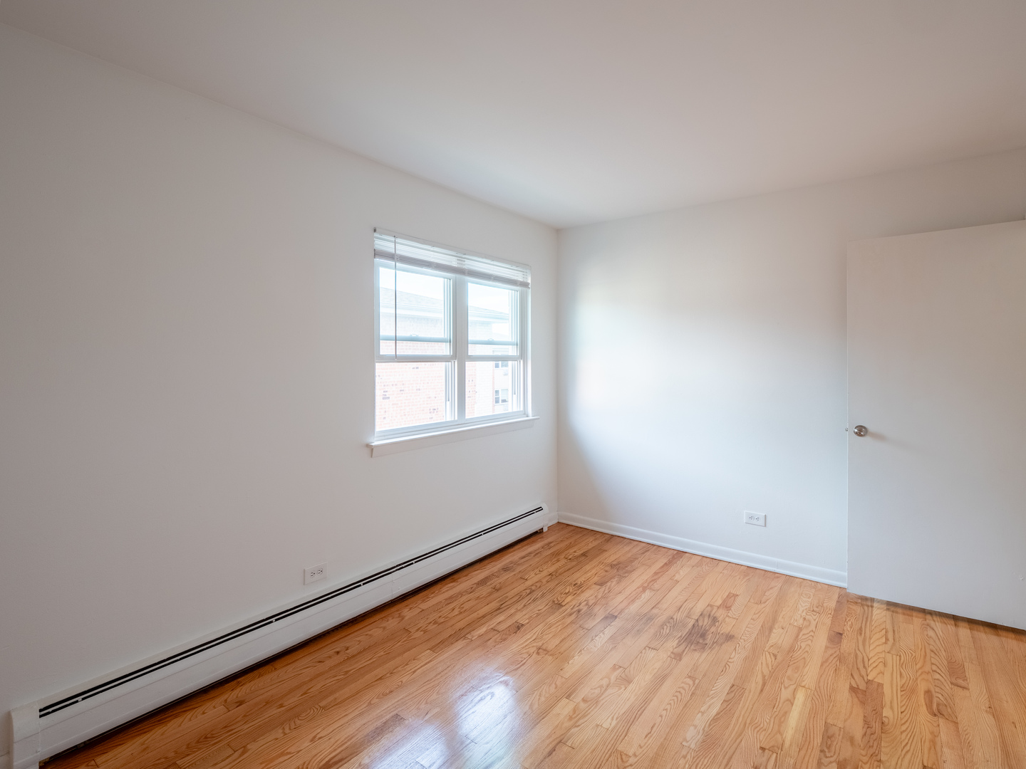 9662 Golf Terrace, Unit 2E Des Plaines, IL 60016 - Photo 9 of 24 an empty room with a window