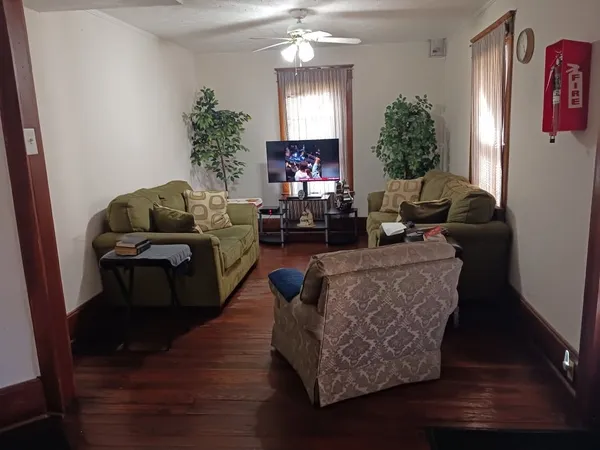 a living room with furniture and a large window