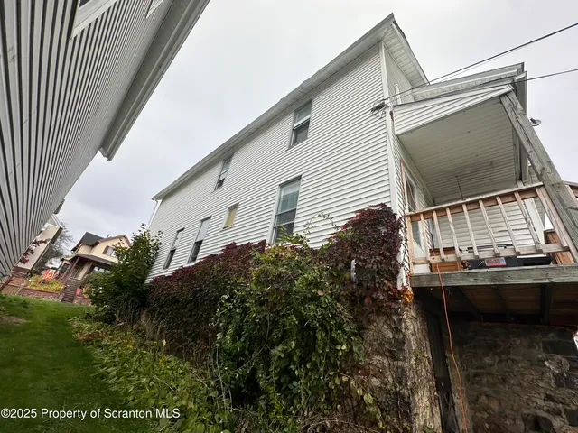 a balcony view with a garden