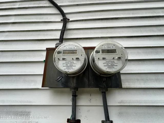 a table with a clock on it and a wooden floor