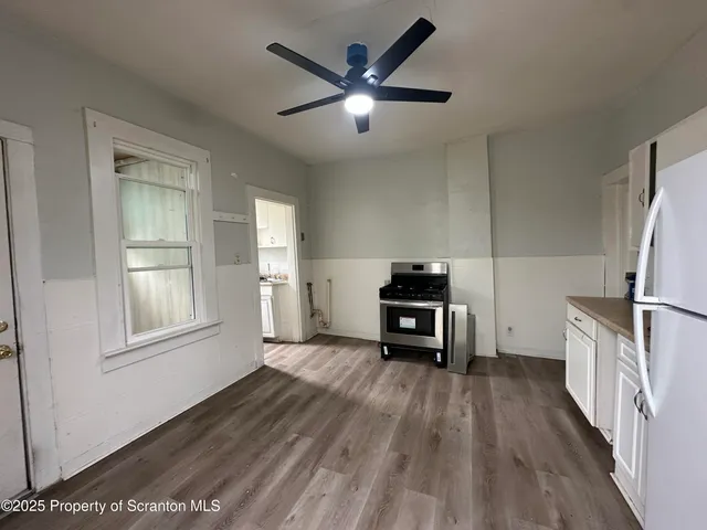 a view of kitchen and wooden floor