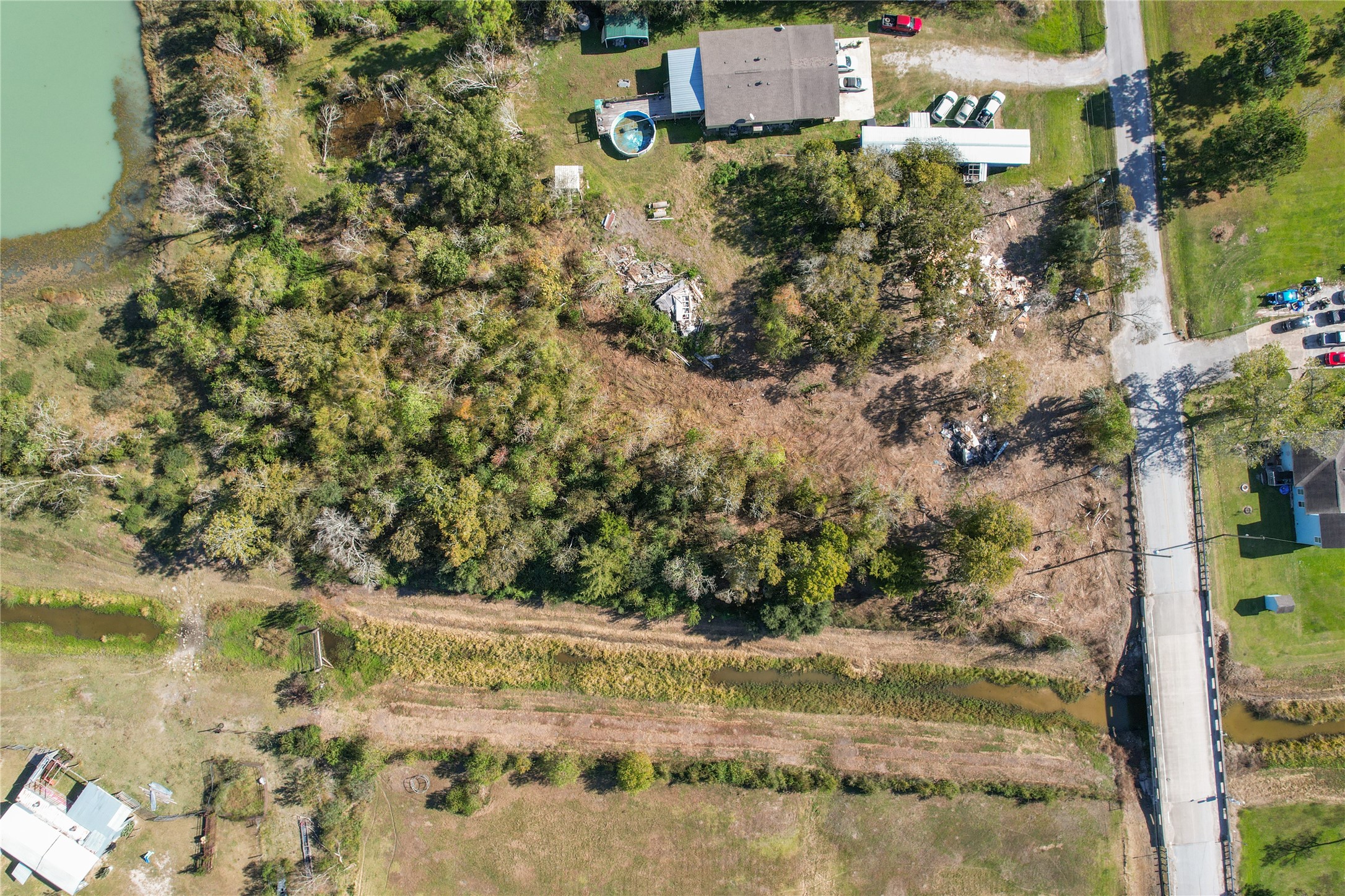 8903 Baker Street Santa Fe, TX 77510 - Photo 6 of 14 a view of a yard with plants and brick wall