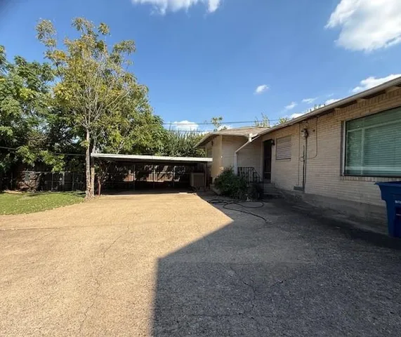 a house with trees in the background