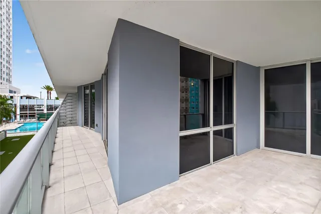 an aerial view of a house with a yard and potted plants