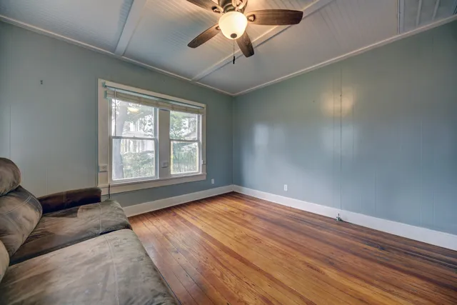 a view of room with window and ceiling fan