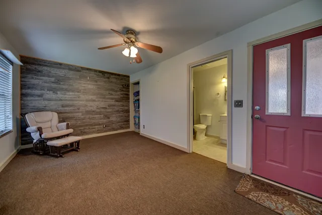 a view of a livingroom with furniture and windows