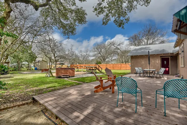 a view of a backyard with furniture