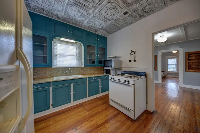 a kitchen with stainless steel appliances granite countertop a stove and a sink