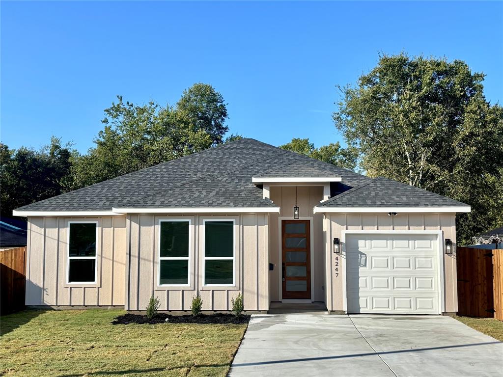 4247 Gladewater Road Dallas, TX 75216 - Photo 1 of 5 a front view of a house with a garden