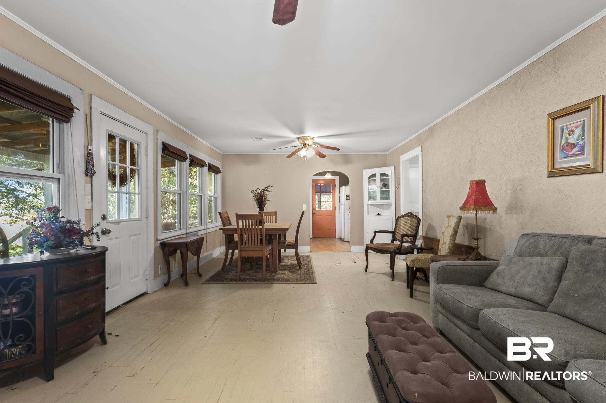 18696 Borck Road Gulf Shores, AL 36542 - Photo 3 of 47 Living room featuring light hardwood / wood-style flooring, ceiling fan, and crown molding