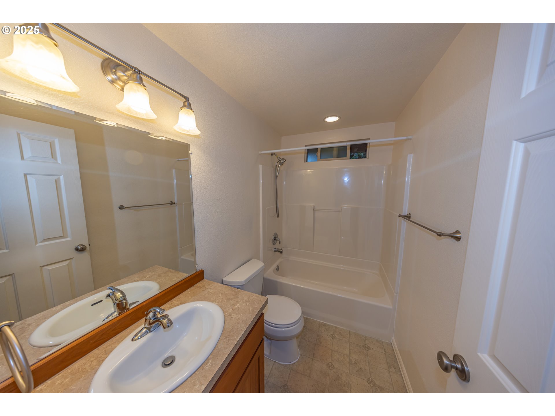 3600 A Street, Unit 6 Washougal, WA 98671 - Photo 13 of 15 a bathroom with a granite countertop sink a toilet a mirror and shower