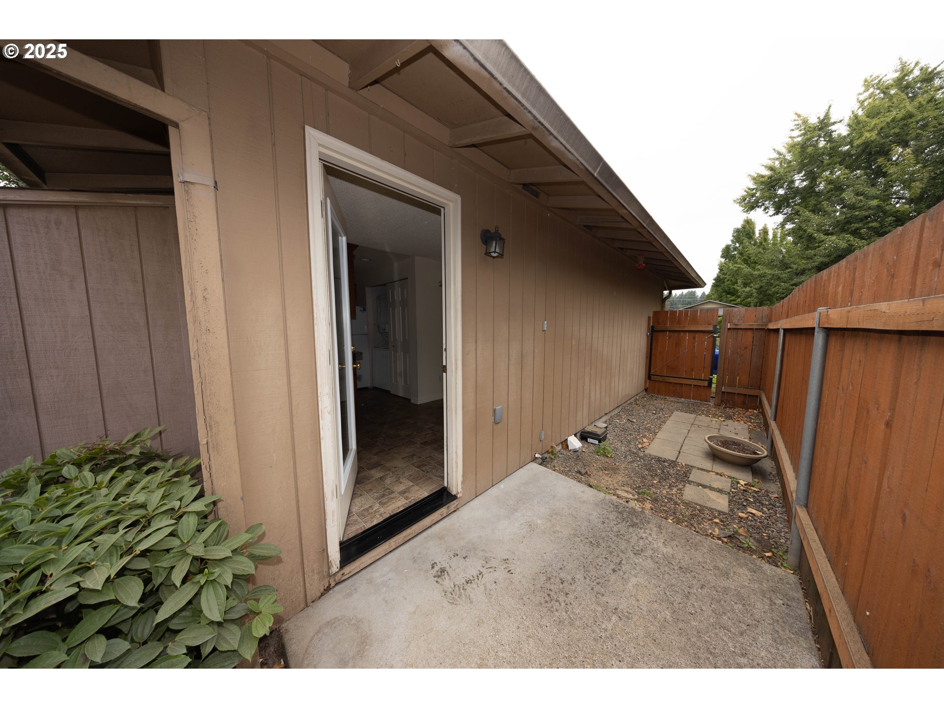 3600 A Street, Unit 6 Washougal, WA 98671 - Photo 2 of 15 a view of a house with backyard and wooden fence