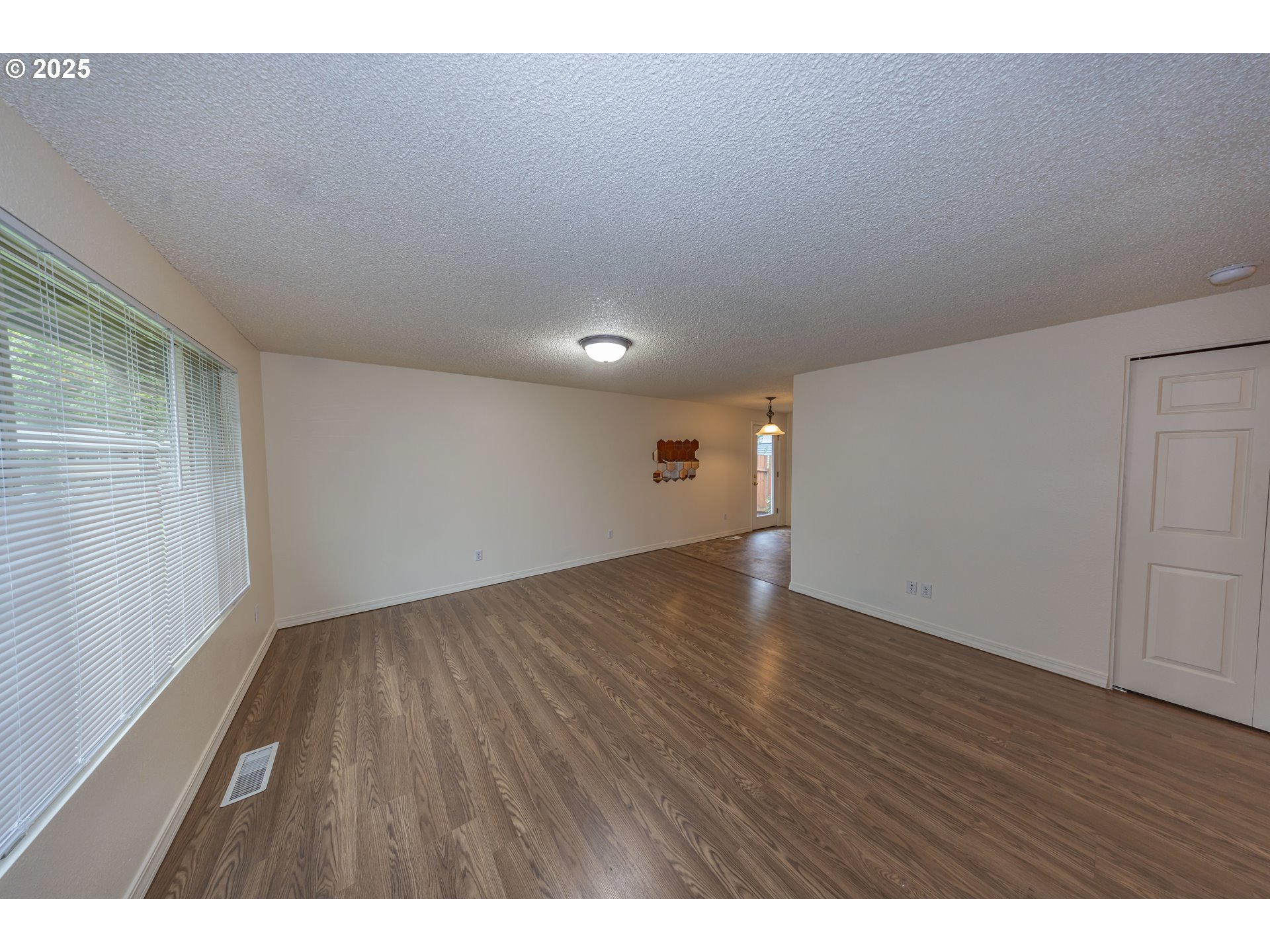 3600 A Street, Unit 6 Washougal, WA 98671 - Photo 4 of 15 a view of an empty room with wooden floor