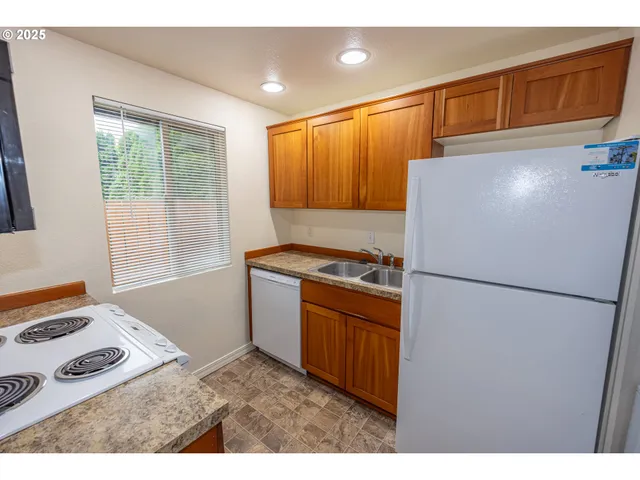 a kitchen with a stove and a microwave