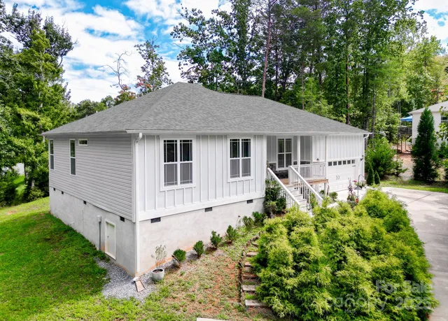 a house with trees in the background