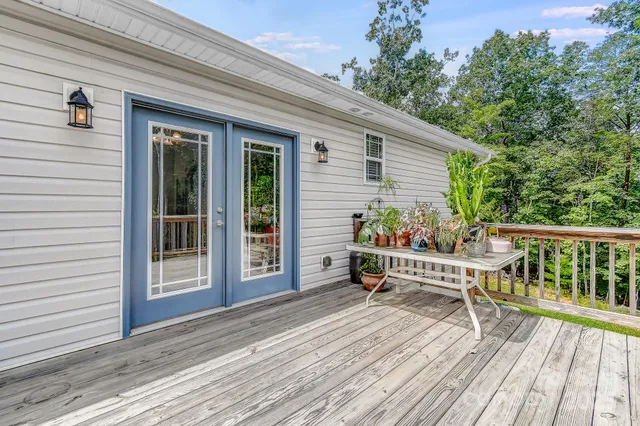 a view of a deck with wooden floor and seating space