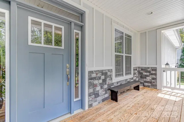 a living room with furniture and windows