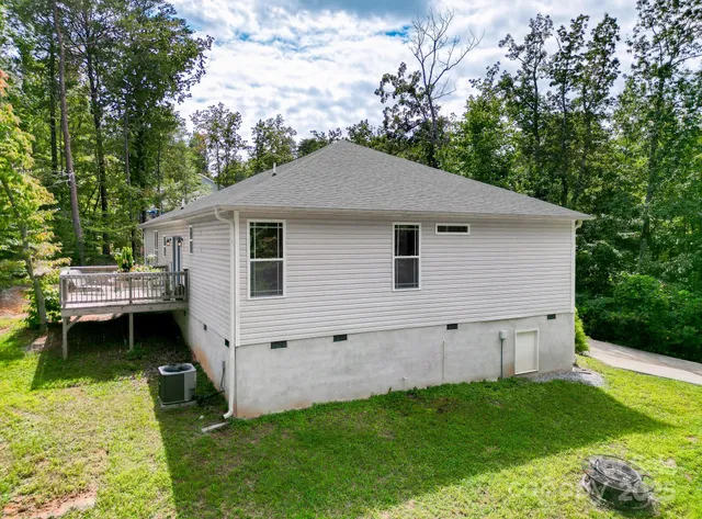 a view of a backyard with plants and a garden