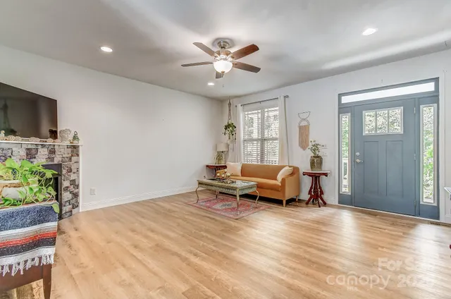 a living room with furniture and a flat screen tv