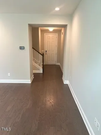 a kitchen with granite countertop a sink a counter top space cabinets and stainless steel appliances
