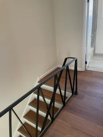 a white toilet sitting next to a bathroom sink