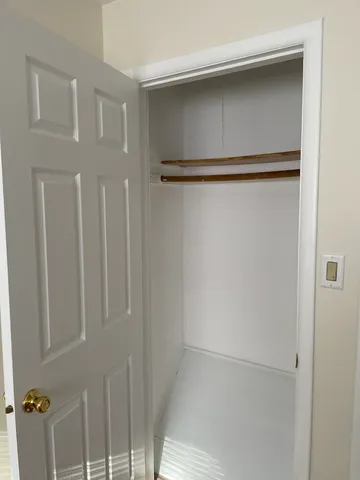 a brick house with four windows