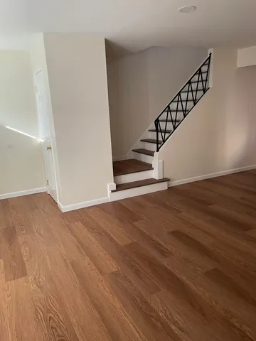 a view of entryway with wooden floor