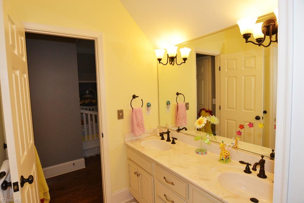1901 Rolling Road Greensboro, NC 27403 - Photo 23 of 30 Jack-and-Jill Bath between Nursery and Additional Second Level Bedroom