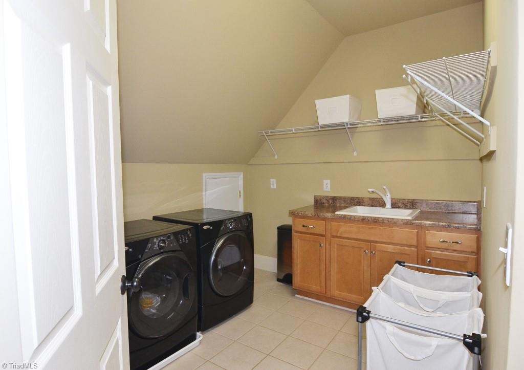 1901 Rolling Road Greensboro, NC 27403 - Photo 25 of 30 Second Level Laundry with Walk In/Stand Up Attic Access