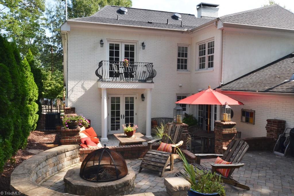 1901 Rolling Road Greensboro, NC 27403 - Photo 29 of 30 Outdoor Entertaining Space with Multiple Seating Areas and Built In Fire Pit