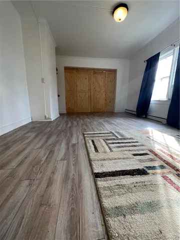 a view of an empty room and window