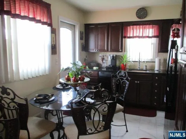 a view of a dining room with furniture and window