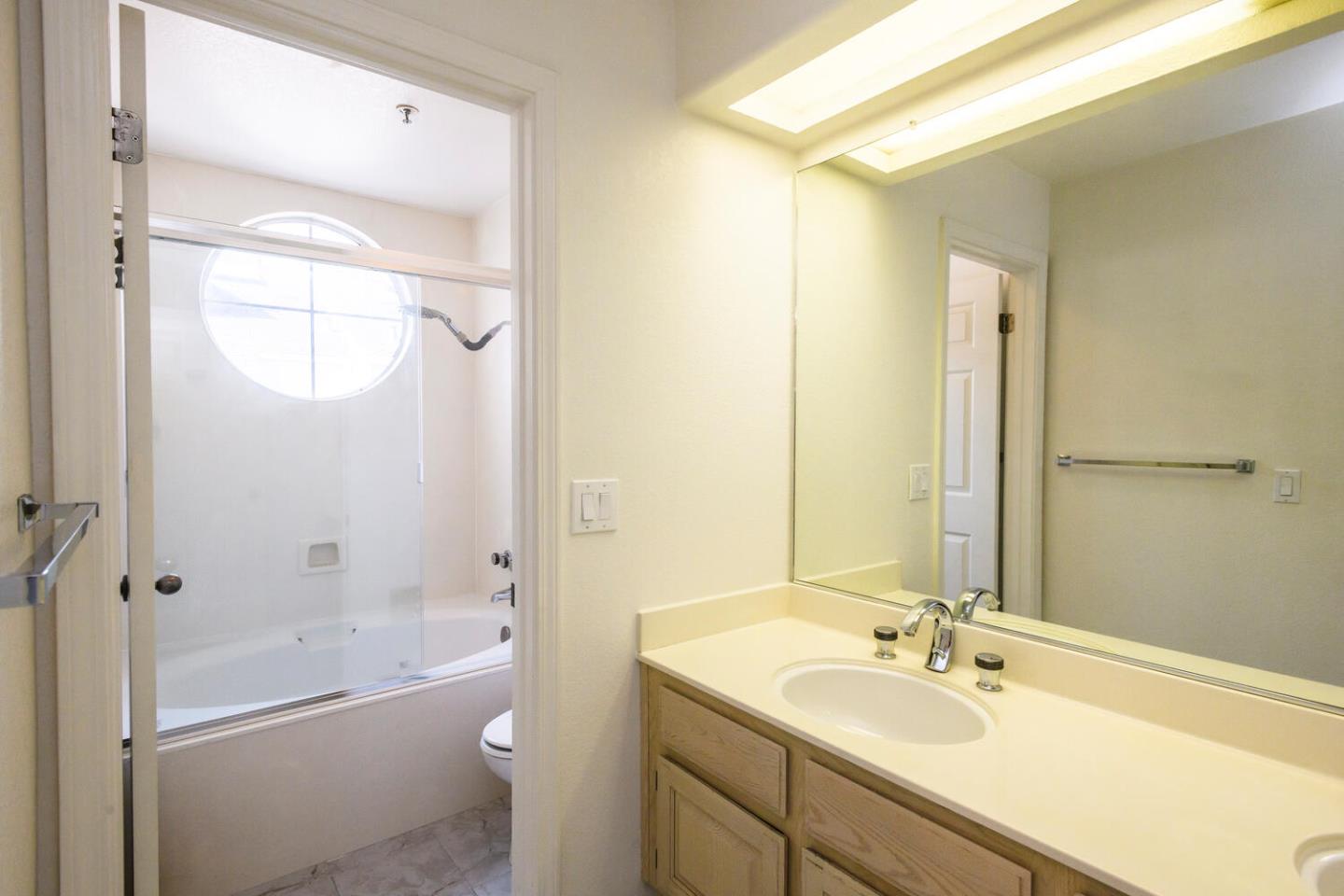 848 Columbia Circle Redwood City, CA 94065 - Photo 11 of 19 a bathroom with a granite countertop sink toilet and shower