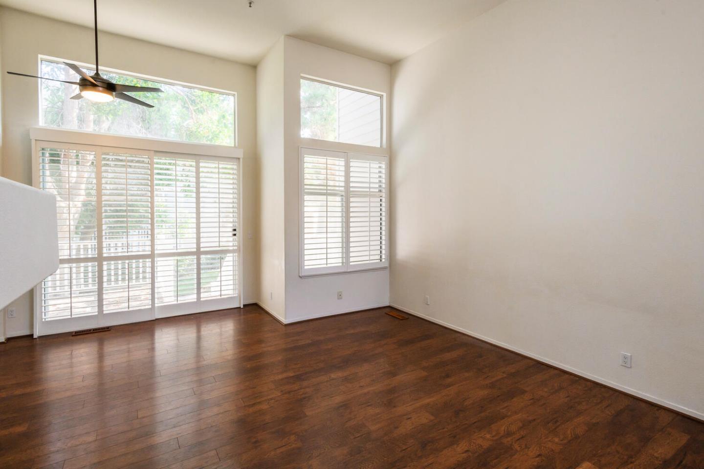 848 Columbia Circle Redwood City, CA 94065 - Photo 6 of 19 a view of an empty room with wooden floor and a window